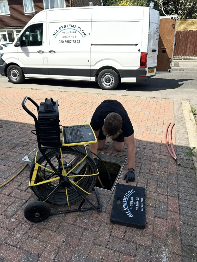 All Systems Flow engineer clearing a blocked drain