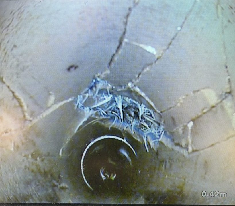 Cracked drain pipe with root ingress before no-dig repair